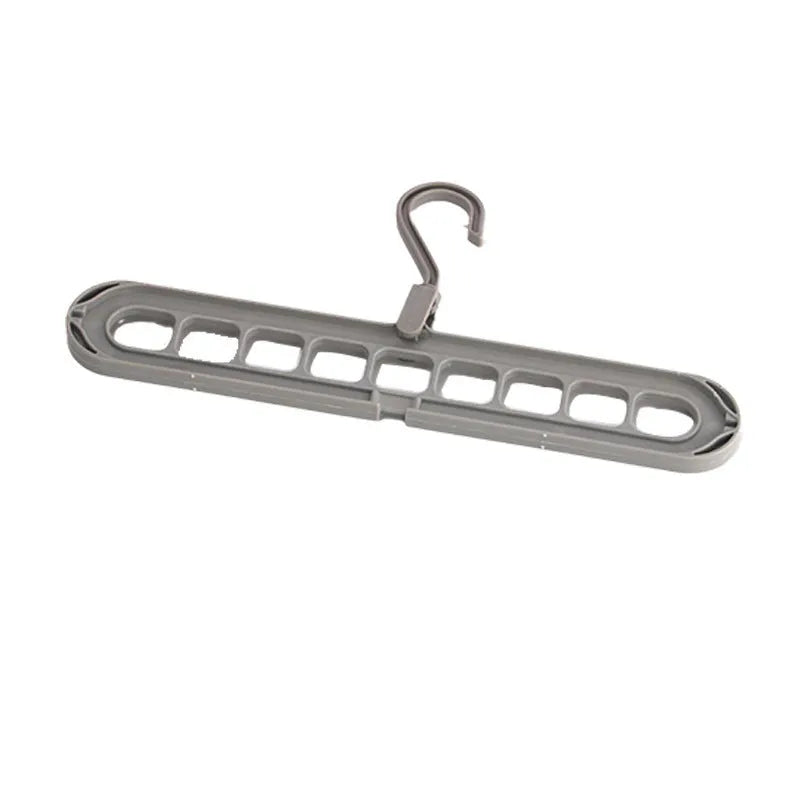 Multifunctional plastic nine-hole folding hanger for trousers, shown in beige, blue, green, pink, and grey colour options.