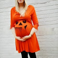 Halloween orange cotton maternity dress with V-neck design on hanger