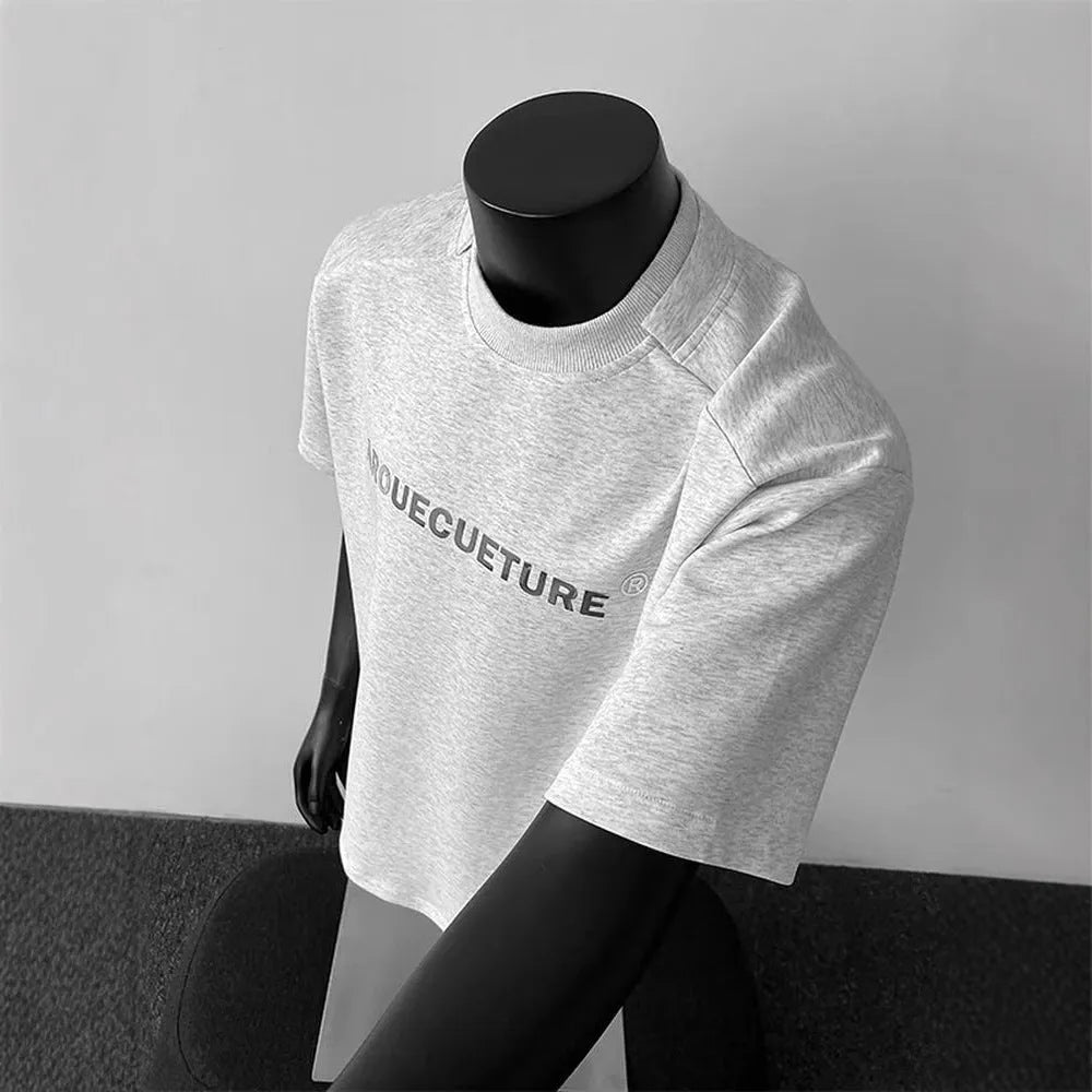 Men's white short sleeve cotton t-shirt with printed letters showing loose fit pullover style