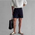 Cotton loose-fit sports shorts in black, white or khaki colour options