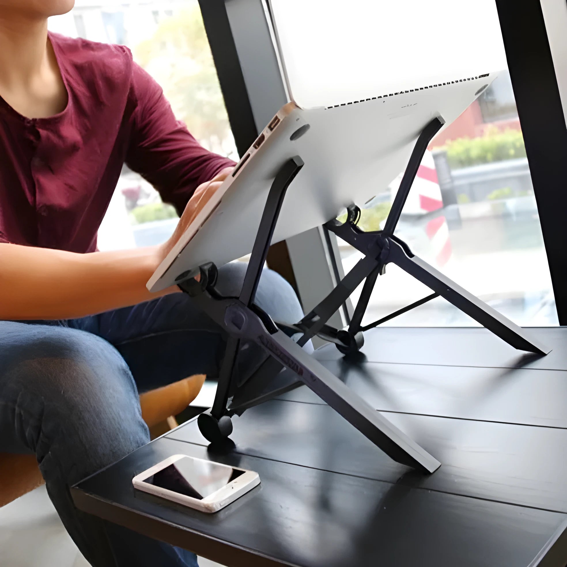 Sagacious black folding laptop stand with carrying case showing 40cm width