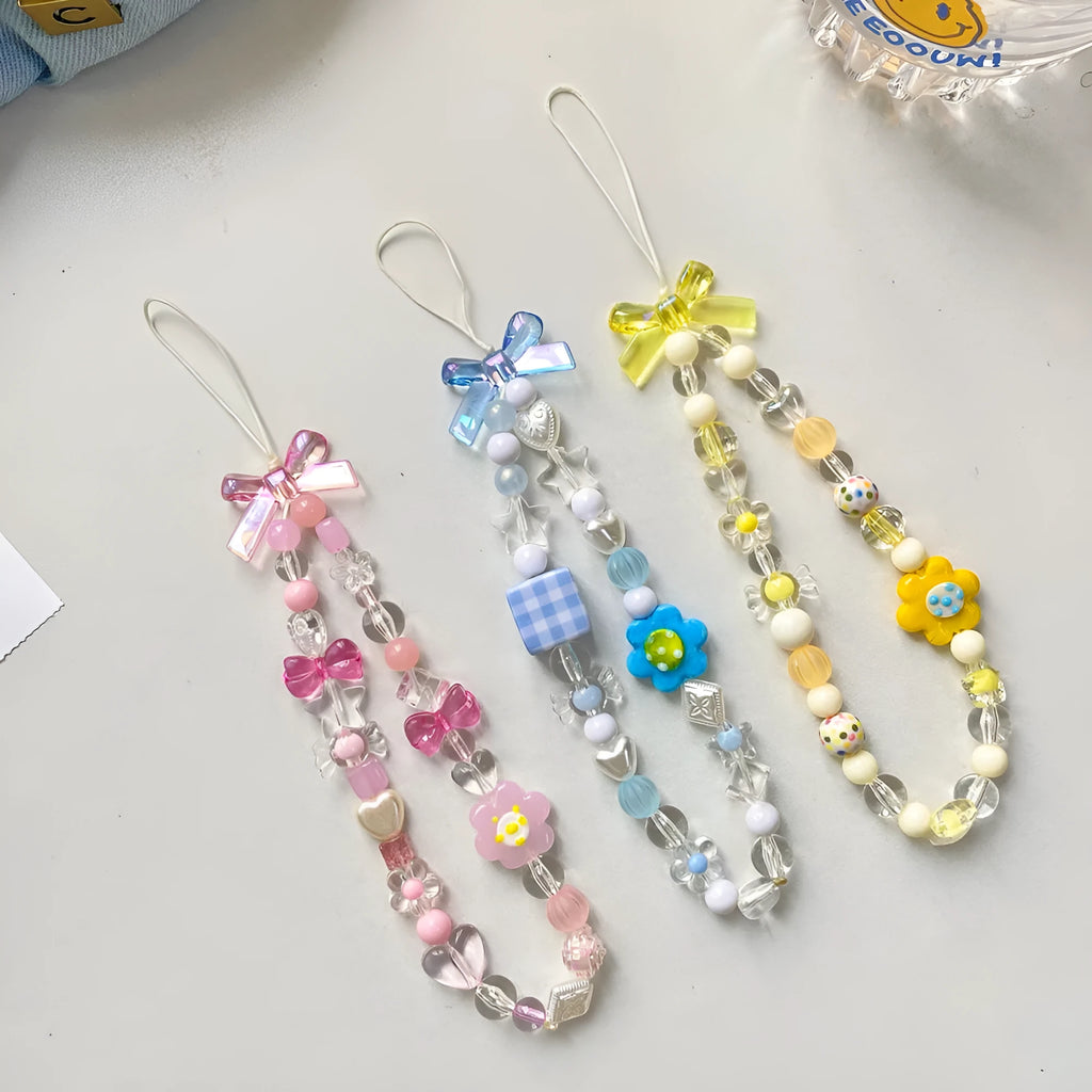 Colourful beaded flower mobile phone lanyard with adjustable hand rope in yellow, blue or pink