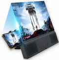 12-inch mobile phone screen amplifier with black ABS housing and built-in speaker for audio playback.