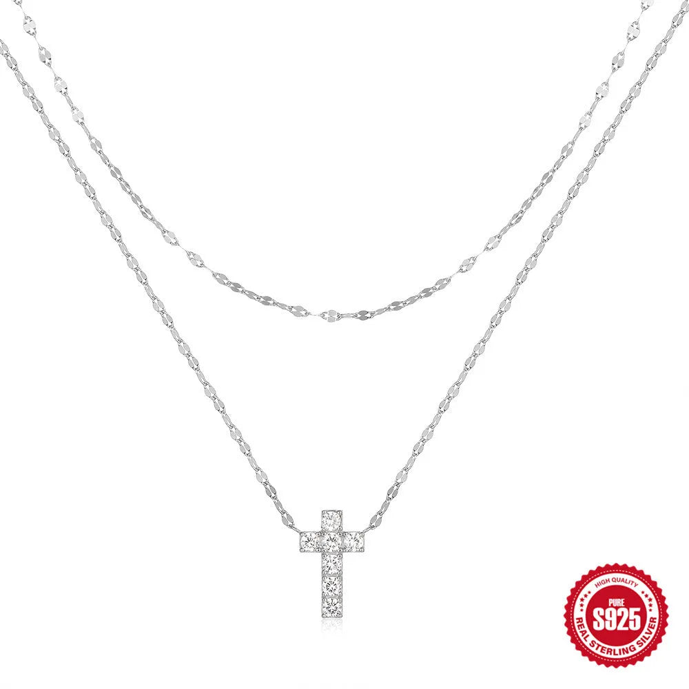 S925 sterling silver double layer cross pendant necklace with diamond accents on a clavicle chain.