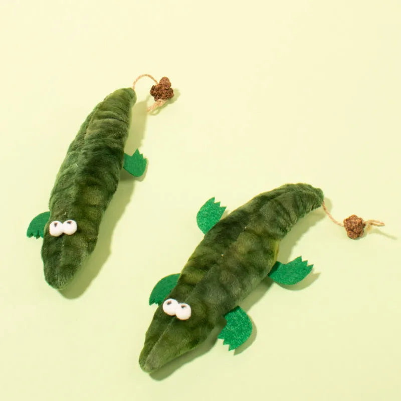 Green plush alligator-shaped cat toy with plant-based catnip and peppermint scent