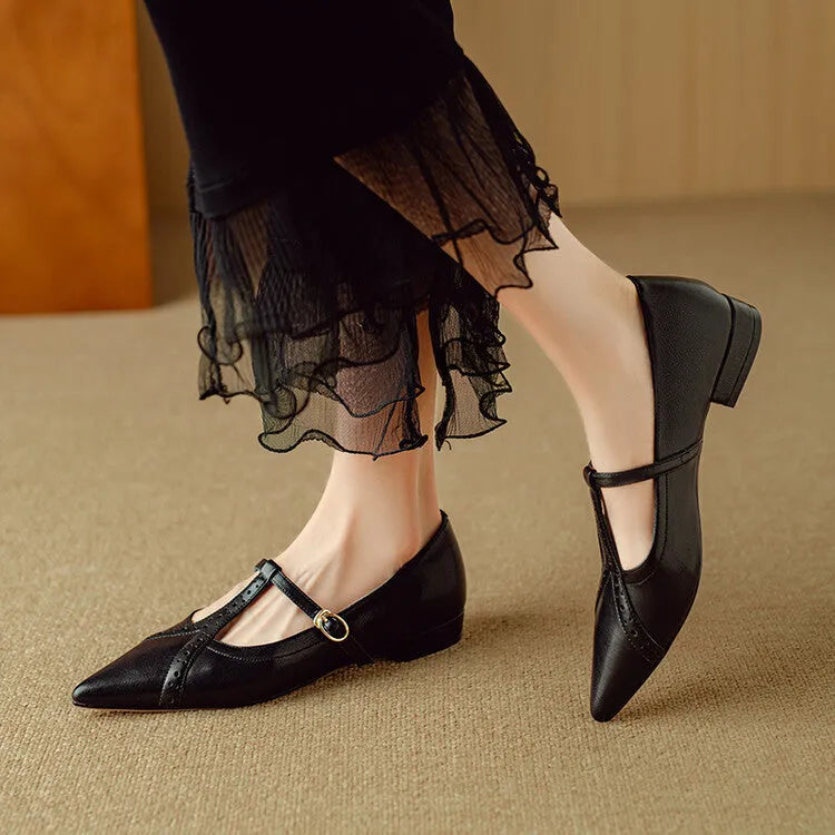 Brown women's round-toe flat shoes with a low heel and metal detail on a leather upper.