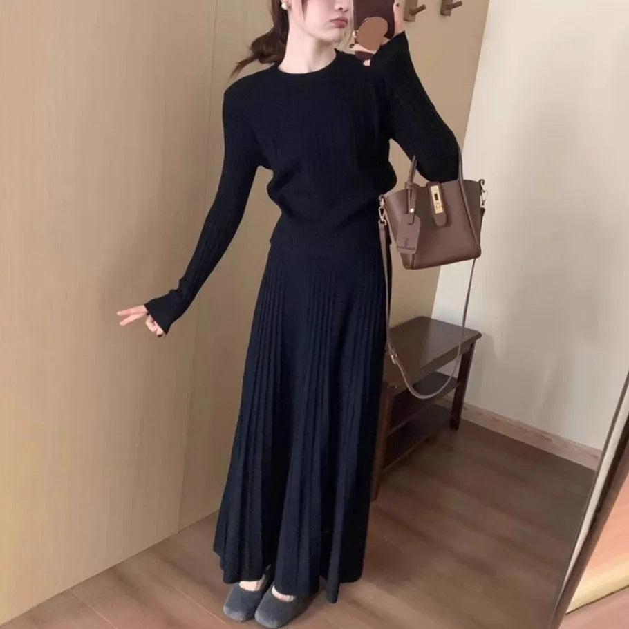 Women's dark grey knitted two-piece suit with artistic collage stitching and retro ethnic style.