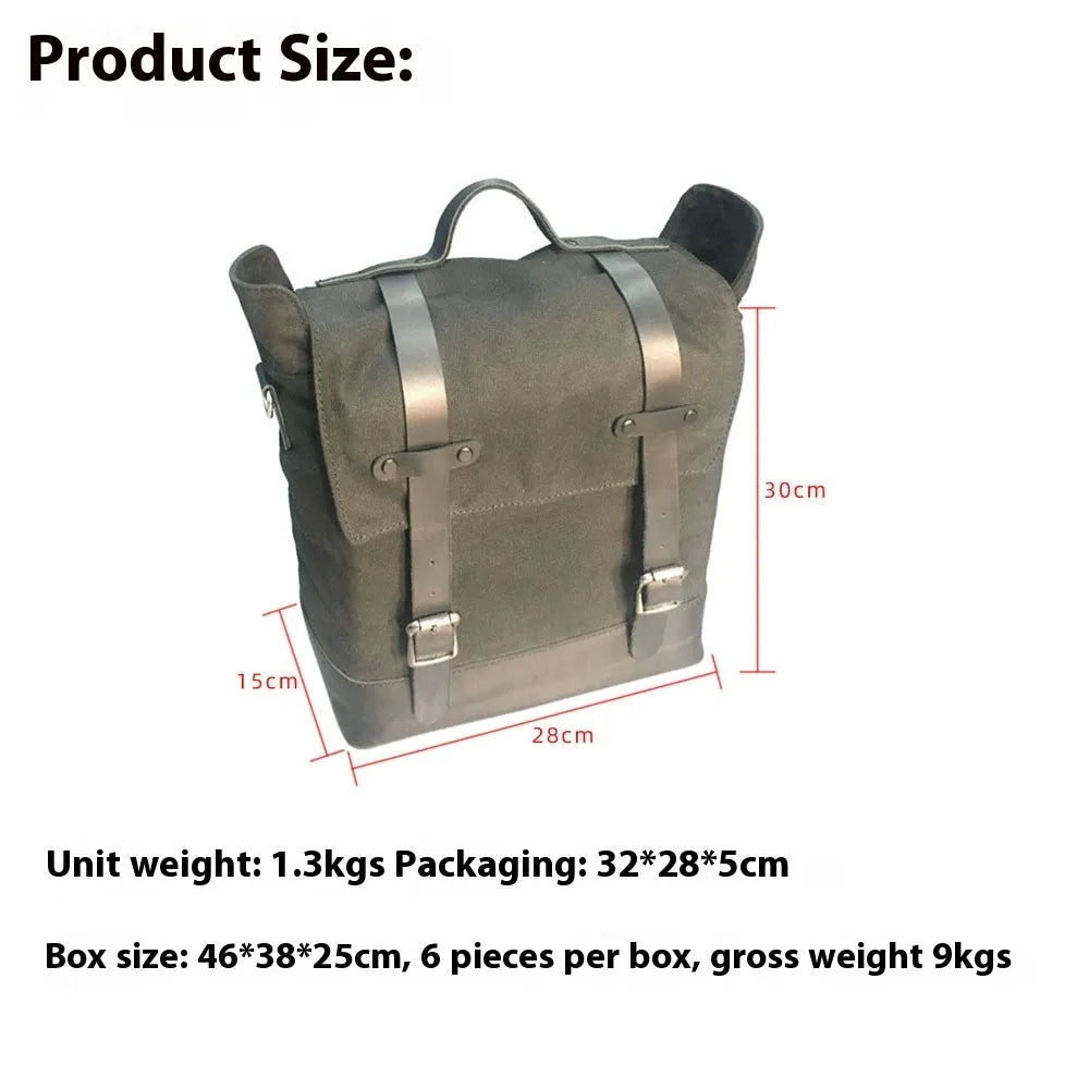 Black waterproof canvas motorcycle side pannier bag with cowhide accents showing mounting straps
