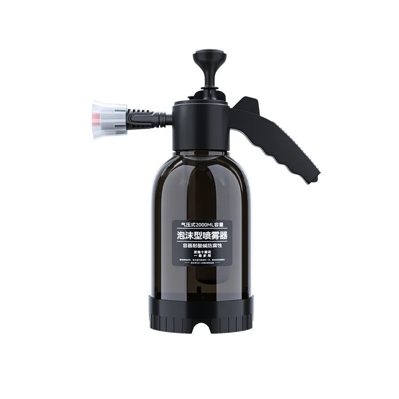 Black hand-held spray sprayer with 2 litre capacity, ergonomic handle, and two nozzles for watering and cleaning.