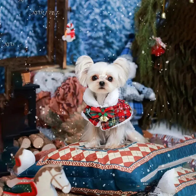 Red pet Christmas scarf with a jingle bell on a dog, showing the polyester fabric and festive design.