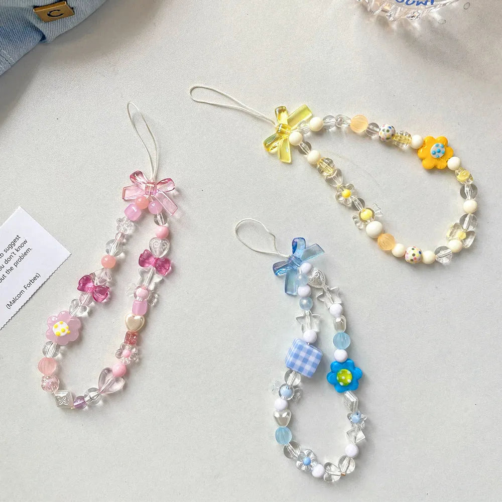 Colourful beaded flower mobile phone lanyard with adjustable hand rope in yellow, blue or pink