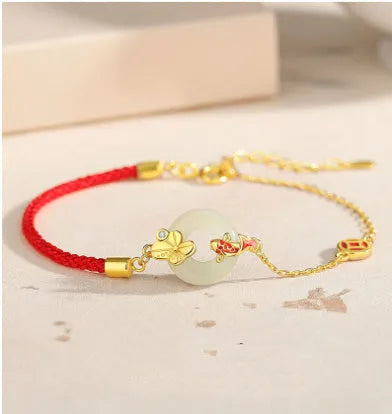 Koi peace buckle hetian jade red rope bracelet in 925 silver with gold electroplated finish