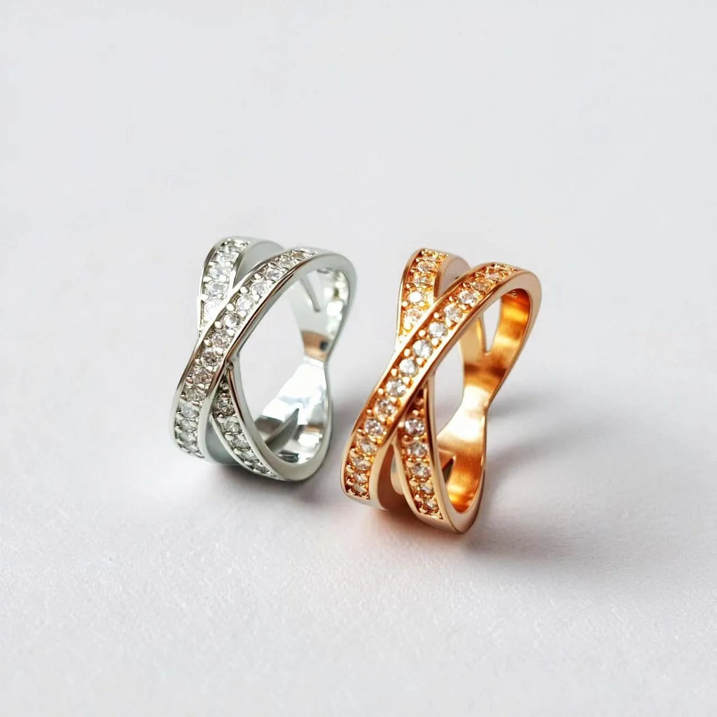 Electroplated copper cross ring with micro-inlaid zircon stones in silver finish