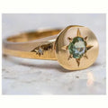 Gold star ring with oval zircon stone on an adjustable zinc alloy band.