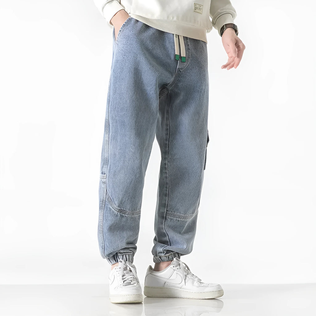 Men's cotton loose-fit tapered trousers in black, blue, or grey colours with mid-waist design
