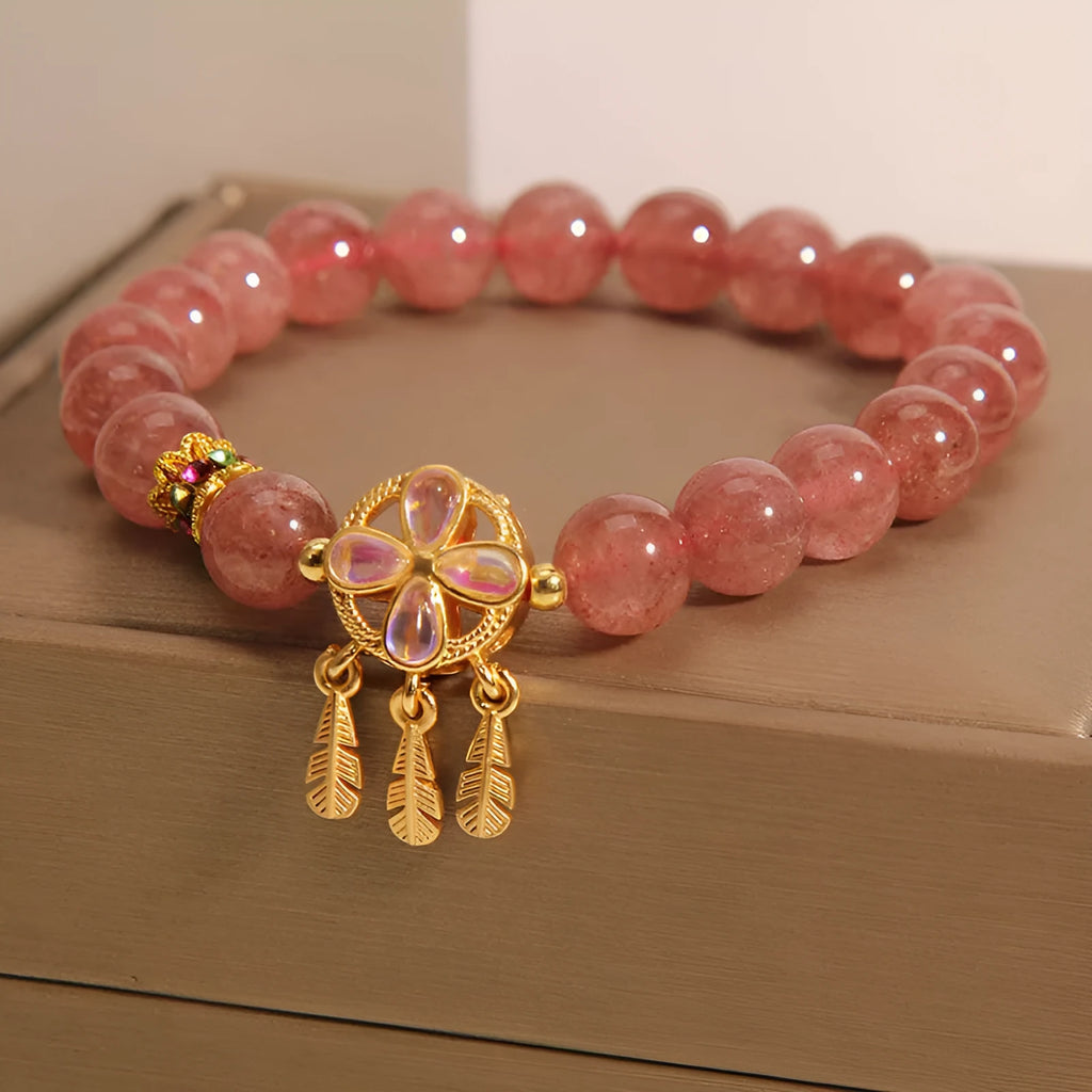 Women's strawberry quartz bracelet with four leaf clover dream catcher ball pendant