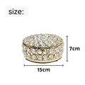 French gold metal jewellery box with a transparent crystal glass lid for storing rings and necklaces.