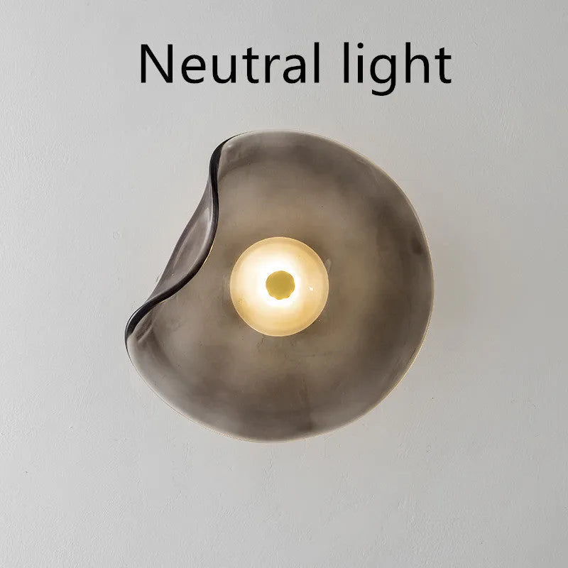 Round glass wall lamp in cognac colour with diffused lighting for bedroom bedside decoration