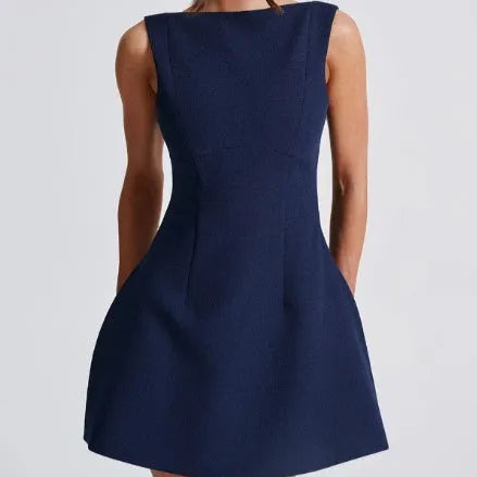 Backless slim-fitting sleeveless summer dress in polyester fabric on a hanger