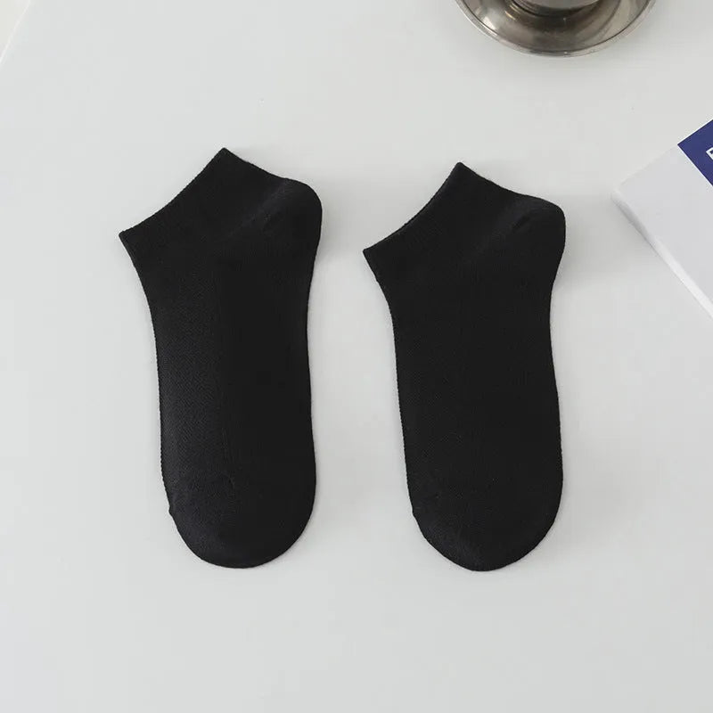 Solid colour low-cut polyester boat socks for men, shown in one of six available colour variants.