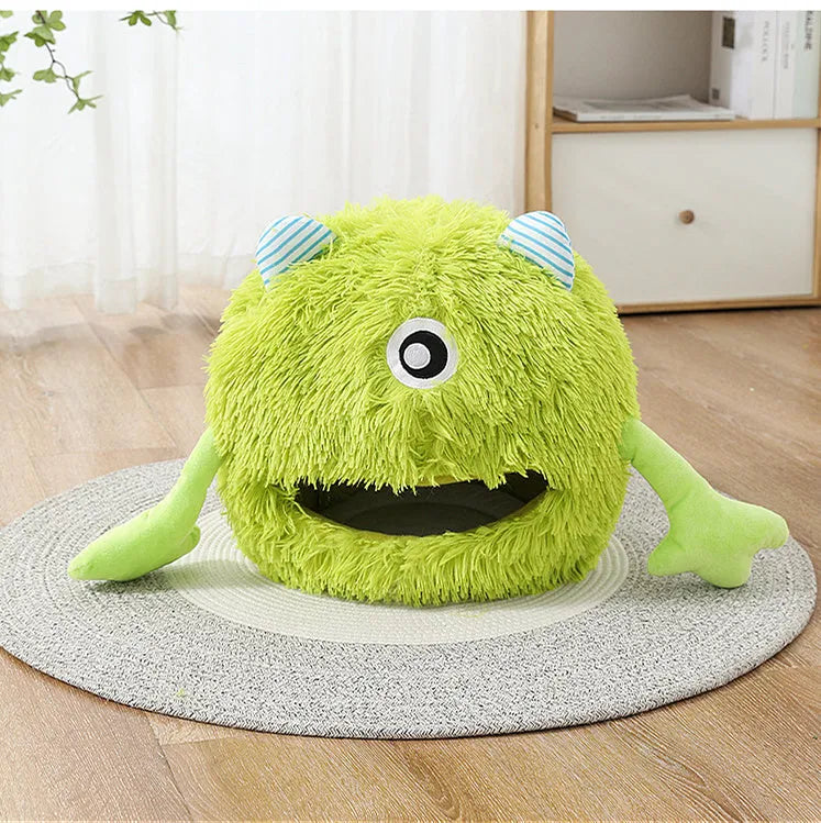 Fluffy round plush pet bed for cats and small dogs on a wooden floor