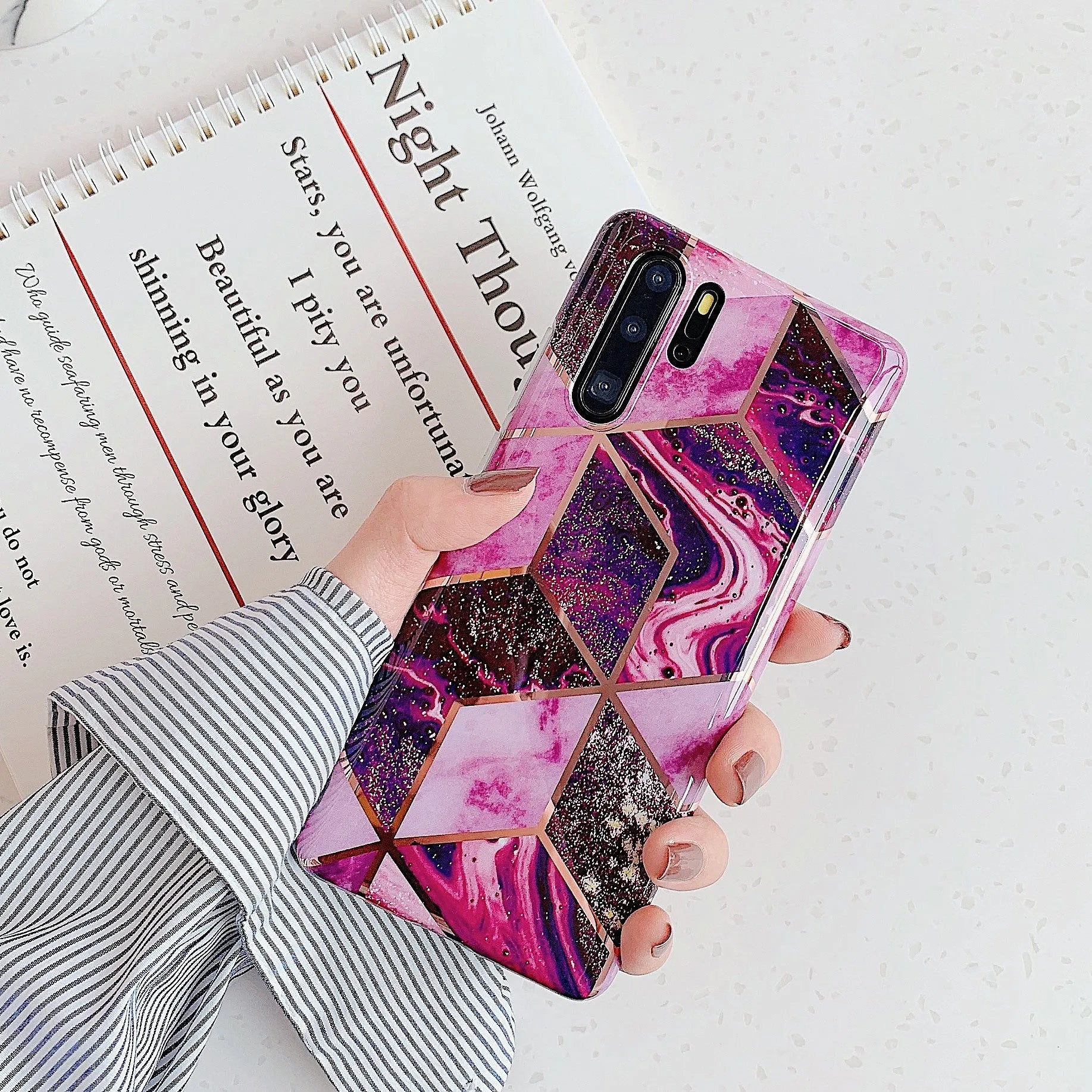 Glossy electroplated marble design TPU back cover case for a Huawei smartphone.