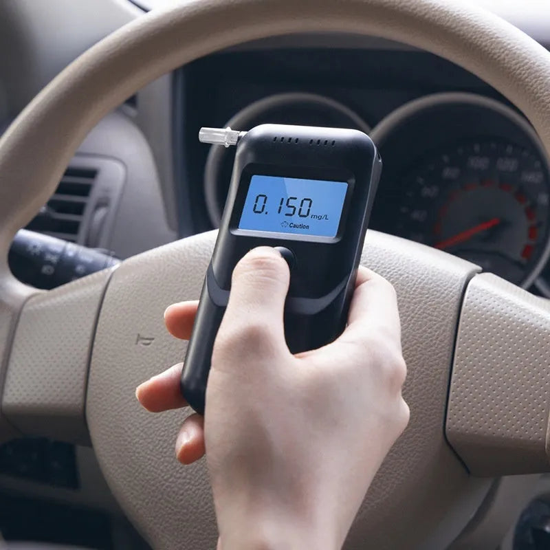 Black household alcohol breath tester with compact design for drinking level monitoring