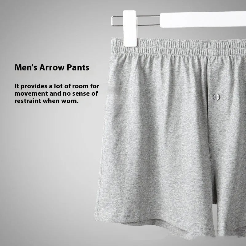 Men's solid colour loose-fit cotton boxer shorts on a white background, showing high waist and leg openings.