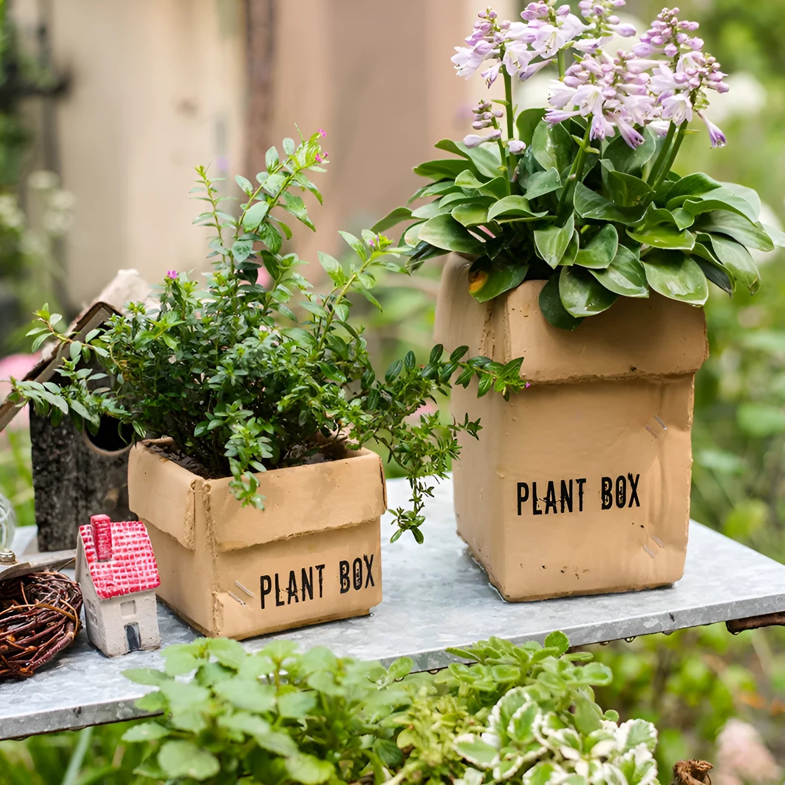 Cement flowerpot with brown paper box design featuring drainage holes