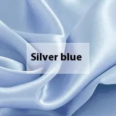 Solid colour double-sided silk duvet cover in bright brown, showing smooth texture and neat corner.