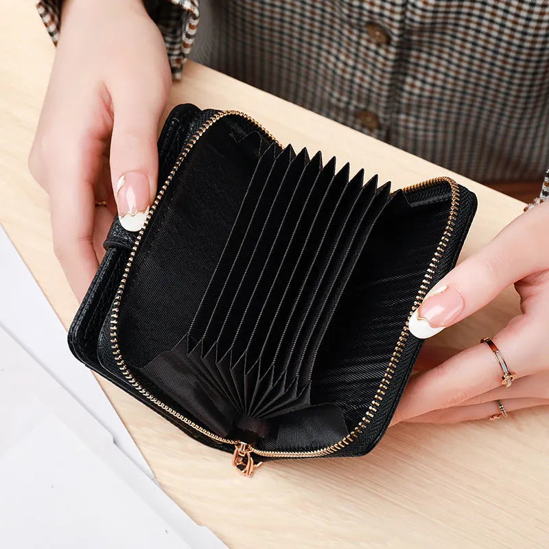 Women's short PU leather wallet with lychee pattern in beige, pink, black, or red.