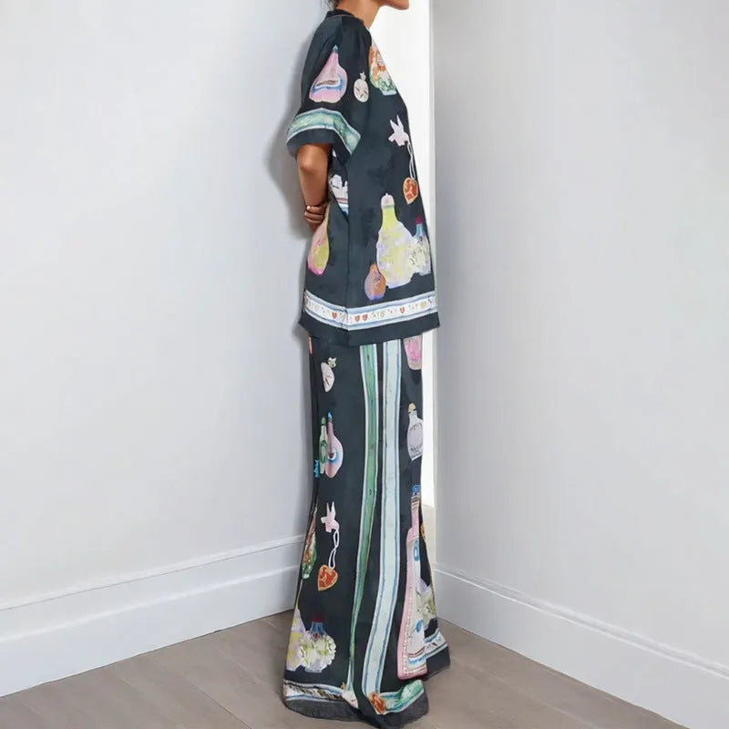 Black women's casual set with cartoon print cardigan top and matching trousers