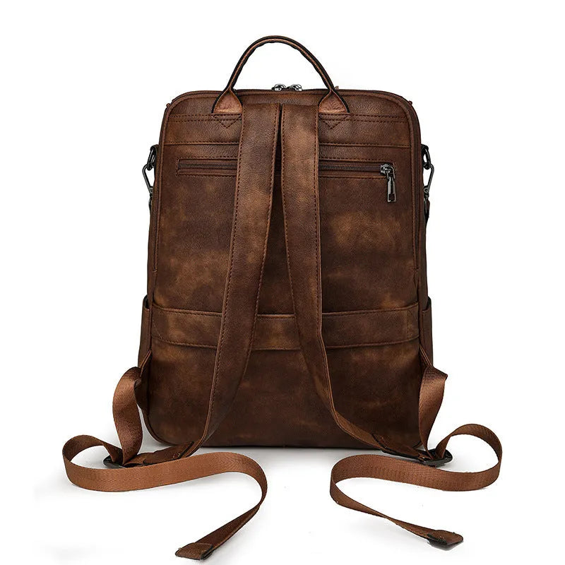 Retro style PU leather college backpack with curved shoulder straps, shown in one of six colour options.