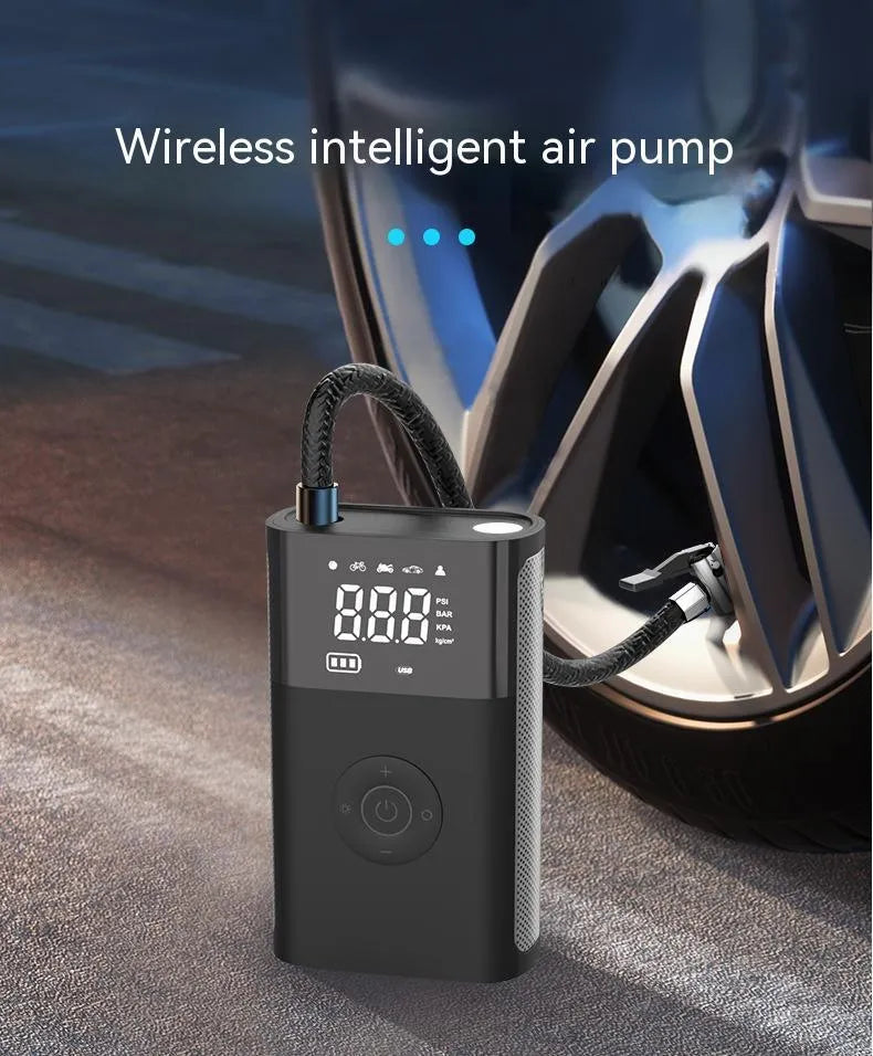 Wireless handheld digital display air pump with LED light and various nozzle attachments on a grey background.