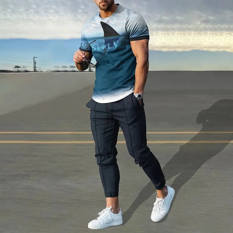 Man wearing a blue short-sleeved round neck pullover and matching trousers from a polyester sportswear set.