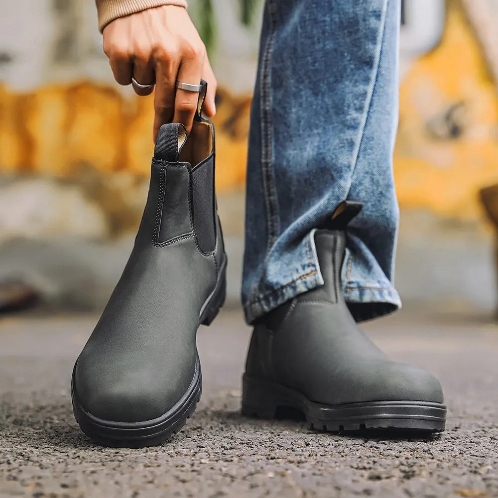 Unisex vintage brown Chelsea boots with a chunky sole and round toe on a white background