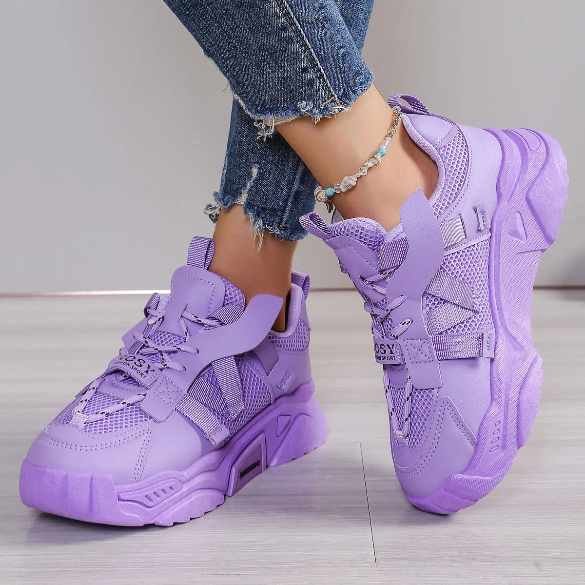 Women's purple platform mesh dad shoes with animal pattern detailing and lace-up front