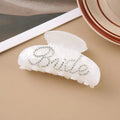 Pink and white acrylic barrette hair clip with diamond spot drilling and English letters.
