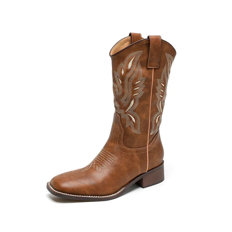 Brown women's mid-calf Martin boots with embroidered pattern, leather lining, and a square rubber sole.