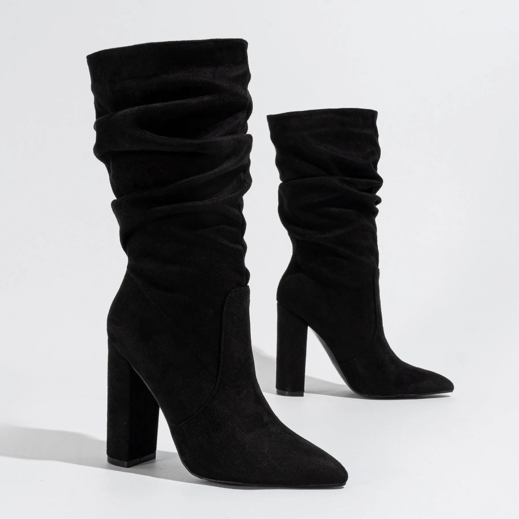 Women's black suede pointed-toe boots with chunky heel and mid-calf shaft height