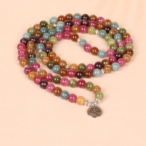 Multi-layer bracelet with 108 beads, a lotus charm, in Tourmaline-coloured alloy.