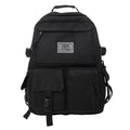 Soft nylon student backpack in black or white with computer compartment and three-dimensional pockets