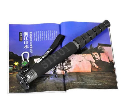 Black carbon fibre six-section telescopic camera monopod shown collapsed and extended.