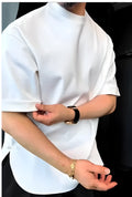 White men's buttoned round neck t-shirt with an extended hem on a model.