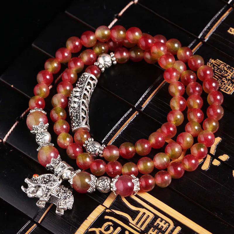 Watermelon crystal bracelet with Chinese knot detailing in geometric national style design
