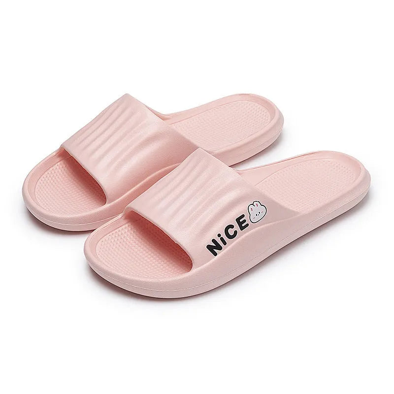 Pair of minimalist EVA flip flop slippers in a choice of six colours, showing the injection moulded non-slip sole.
