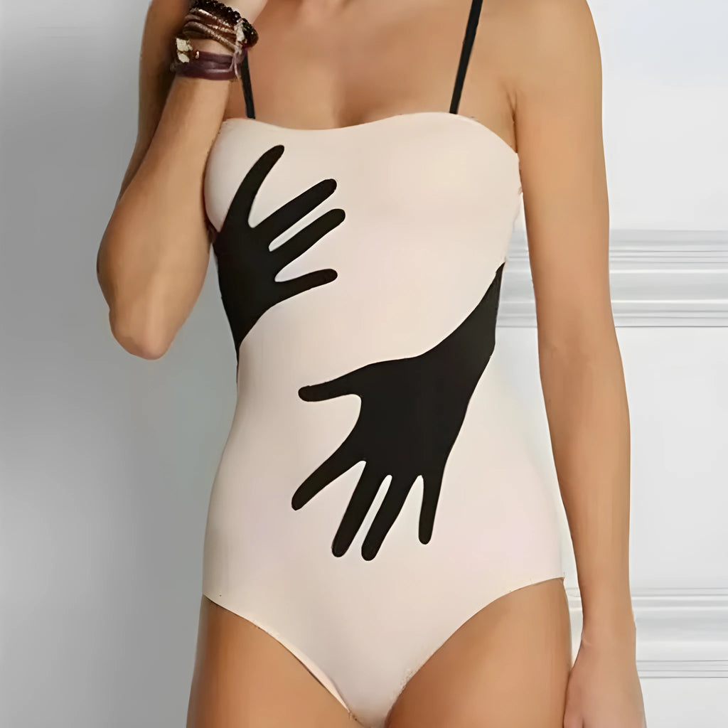 Women's one-piece bikini swimsuit with a gauze skirt cover-up.