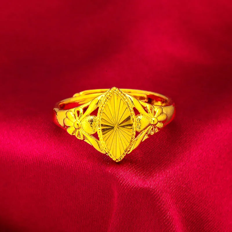Gold geometric ring with open diamond floral pattern and textured surface