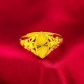 Gold geometric ring with open diamond floral pattern and textured surface