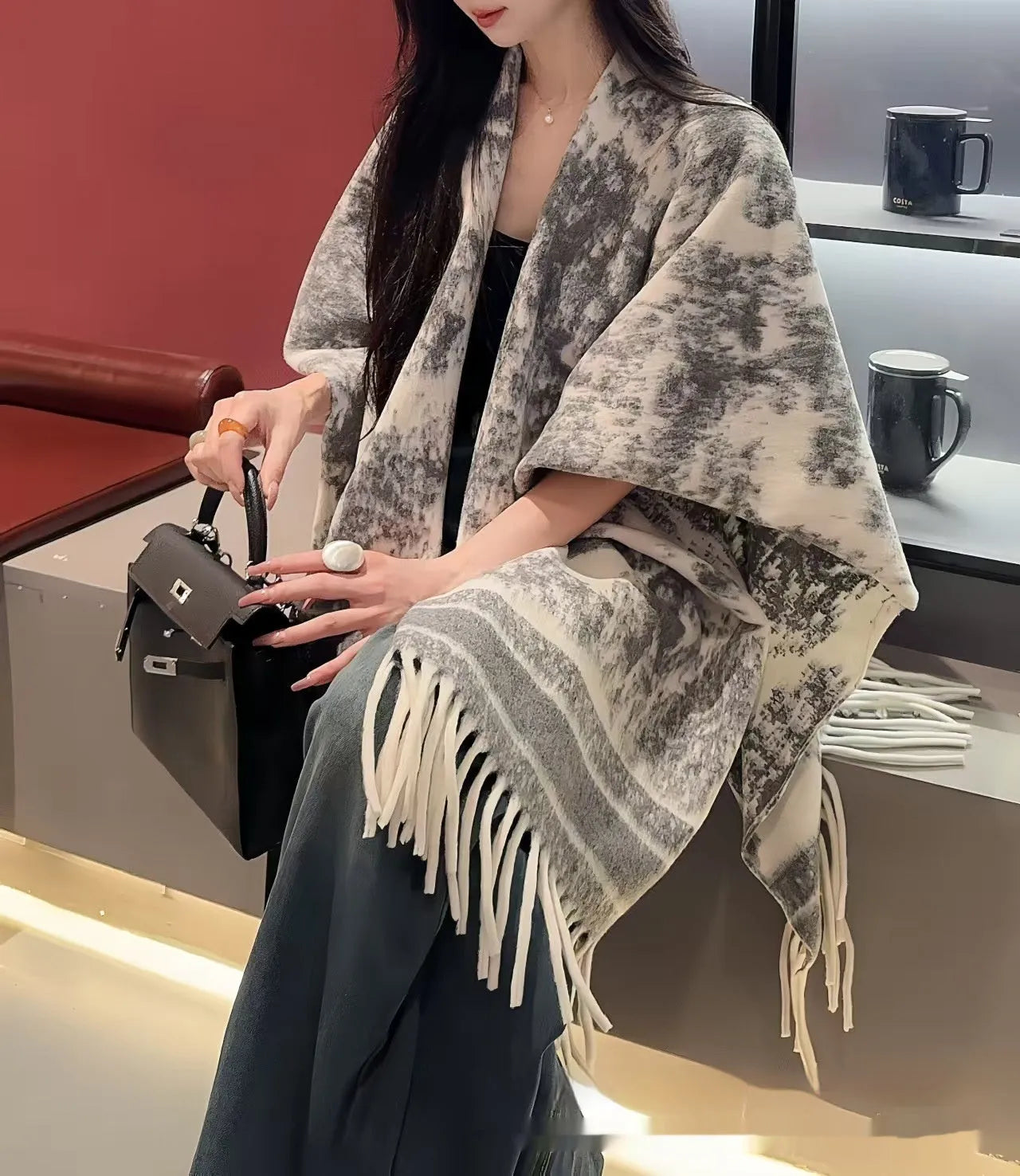Women's polyester scarf cape with tassel edges worn as shawl in casual style